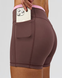 Woman wearing Bree Fusion High-Rise 4" Short Pockets - Cocoa Powder-Pink Rose | Model:Taneisha | Size:XS | Thumbnail Index: 1