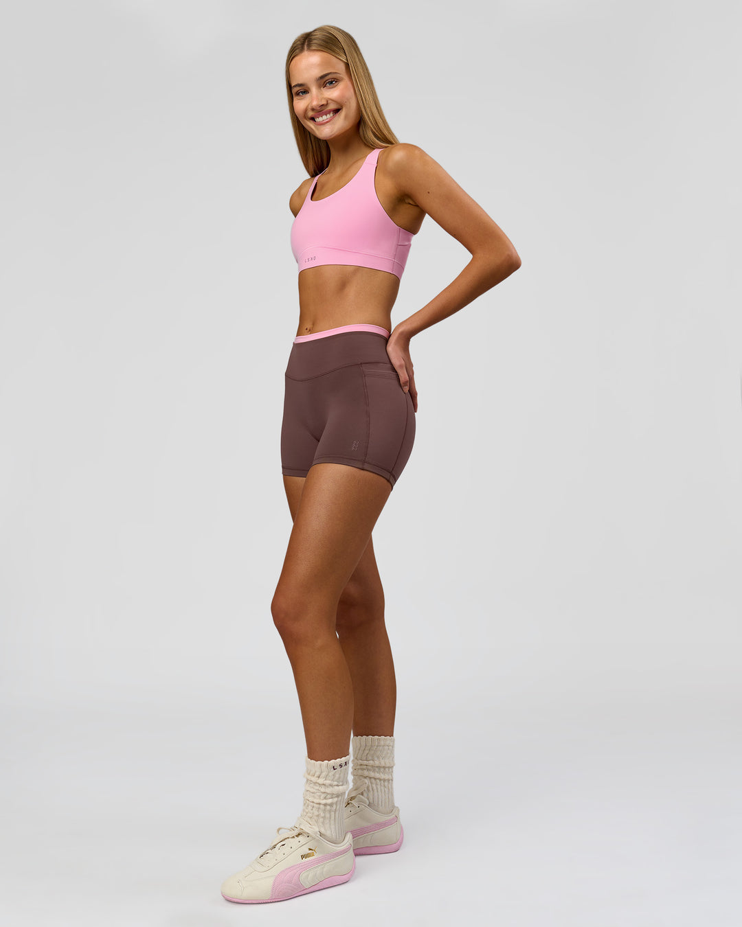 Woman wearing Bree Fusion High-Rise 4" Short Pockets - Cocoa Powder-Pink Rose | Model:Taneisha | Size:XS - view 19