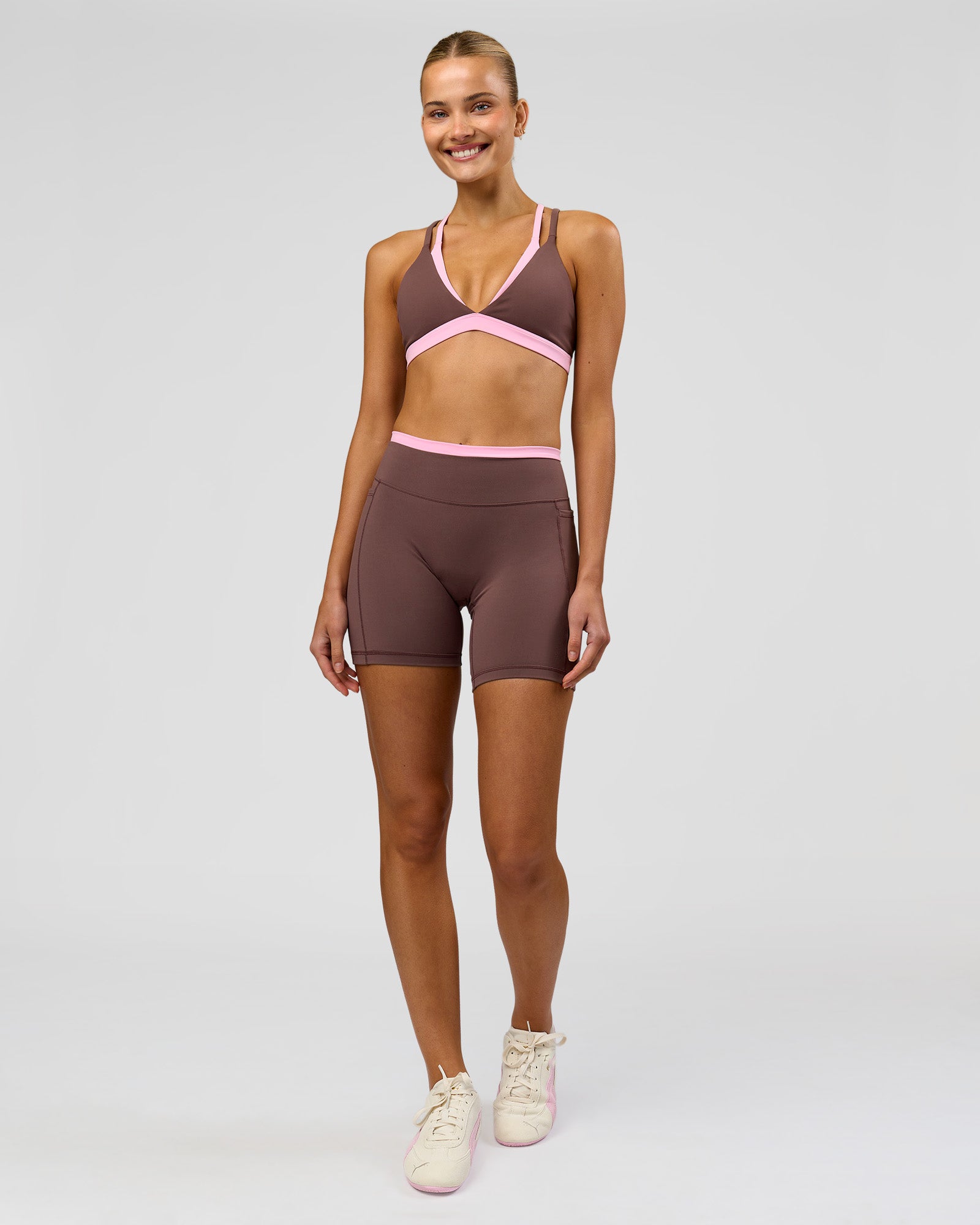 Woman wearing Bree Fusion High-Rise 6" Short Pockets - Cocoa Powder-Pink Rose | Model:Taneisha | Size:XS