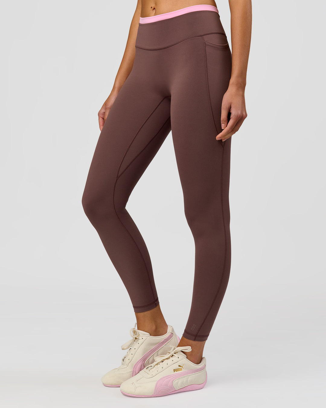 Woman wearing Bree Fusion High-Rise Full Length Legging Pockets - Cocoa Powder-Pink Rose | Model:Taneisha | Size:XS - view 1