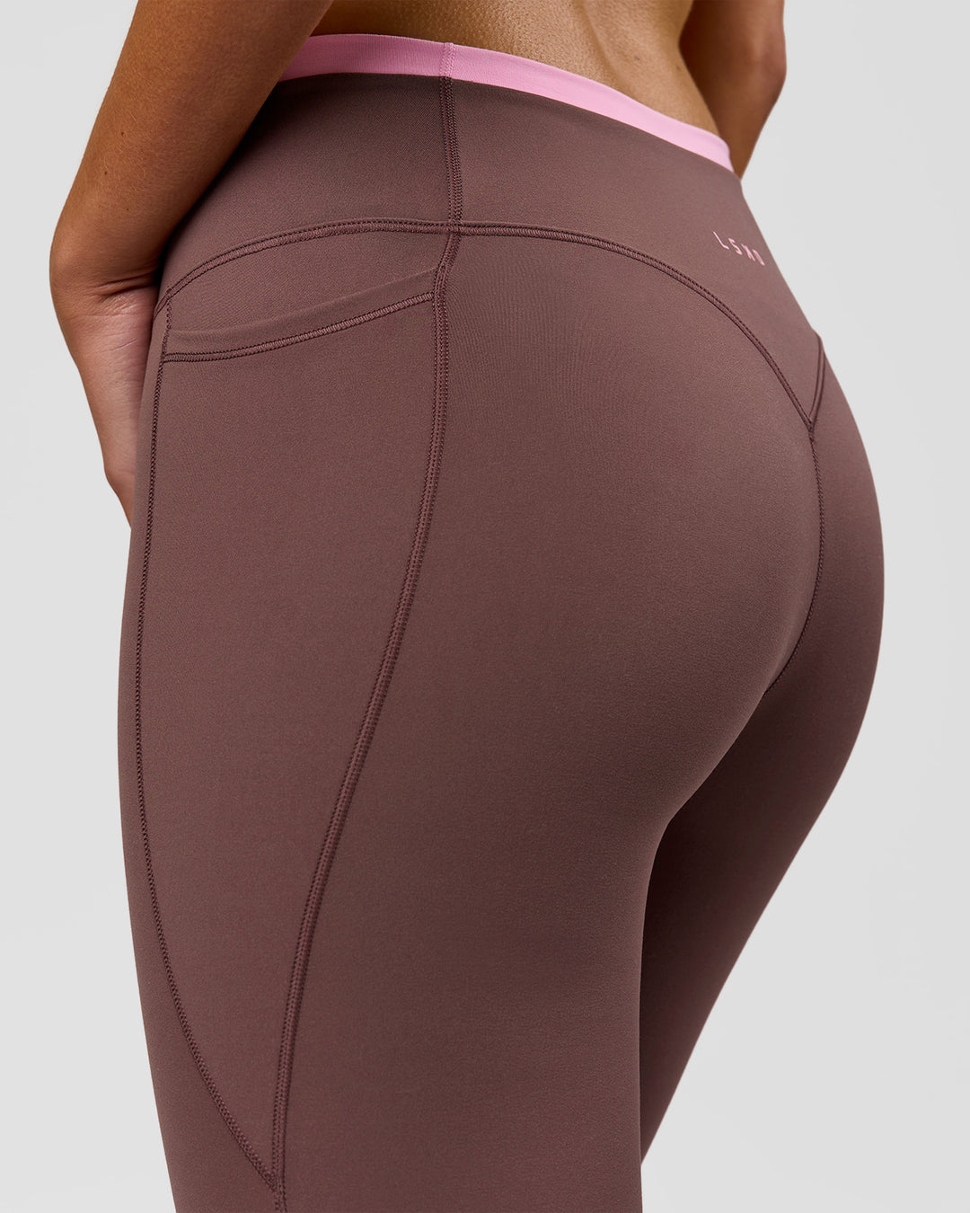 Woman wearing Bree Fusion High-Rise Full Length Legging Pockets - Cocoa Powder-Pink Rose | Model:Taneisha | Size:XS - view 12