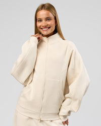 Woman wearing Bree Oversized Fleece Zip Thru - Vanilla Bean | Model:Taneisha | Size:XS | Thumbnail Index: 9