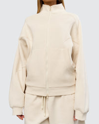 Woman wearing Bree Oversized Fleece Zip Thru - Vanilla Bean | Model:Taneisha | Size:XS | Thumbnail Index: 12