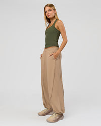 Woman wearing Flow Rib Scoop Neck Tank - Pure Olive | Model:Taneisha | Size:XS | Thumbnail Index: 2