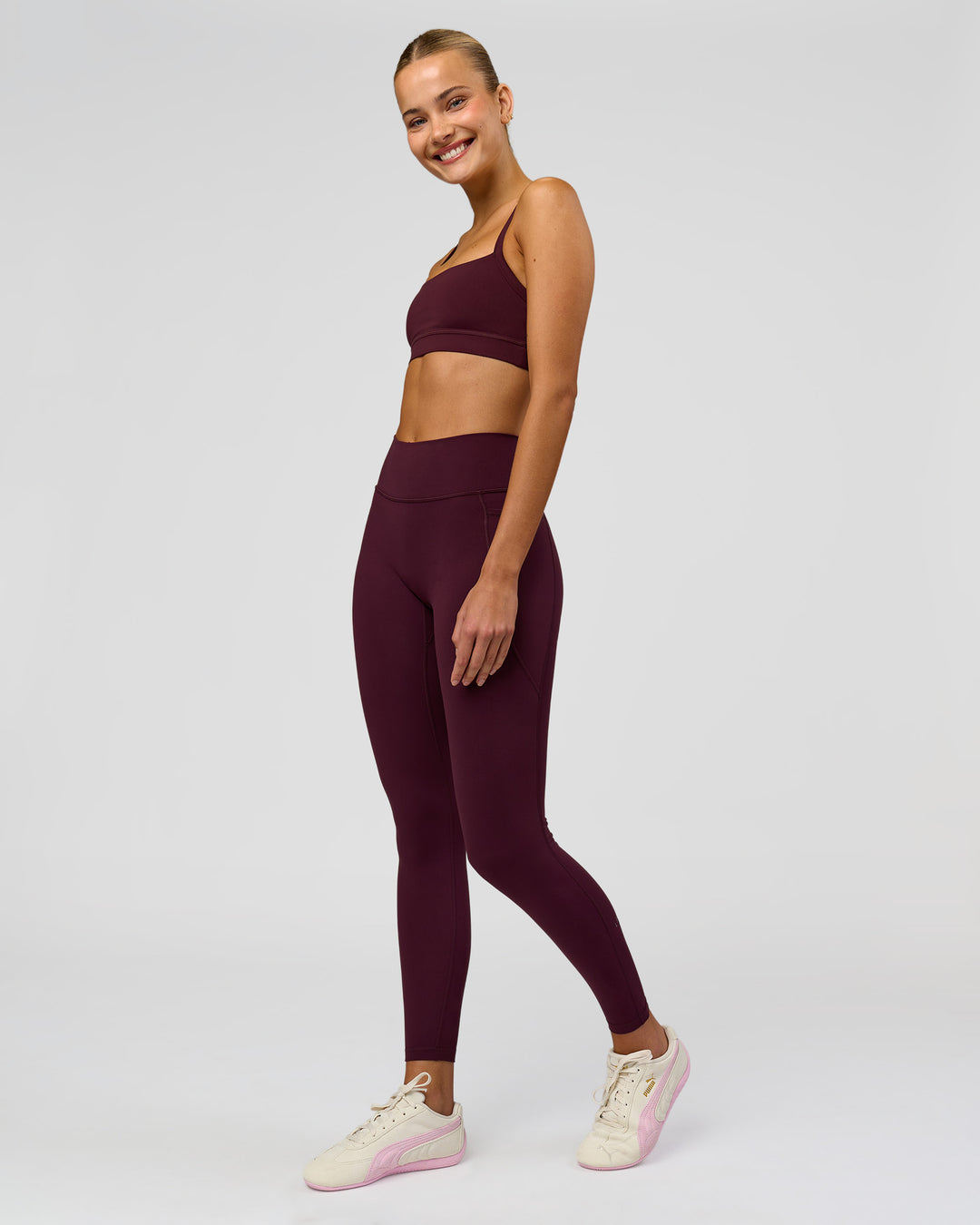 Woman wearing Fusion High-Rise Full Length Legging Pockets - Cherry Lacquer | Model:Taneisha | Size:XS - view 1