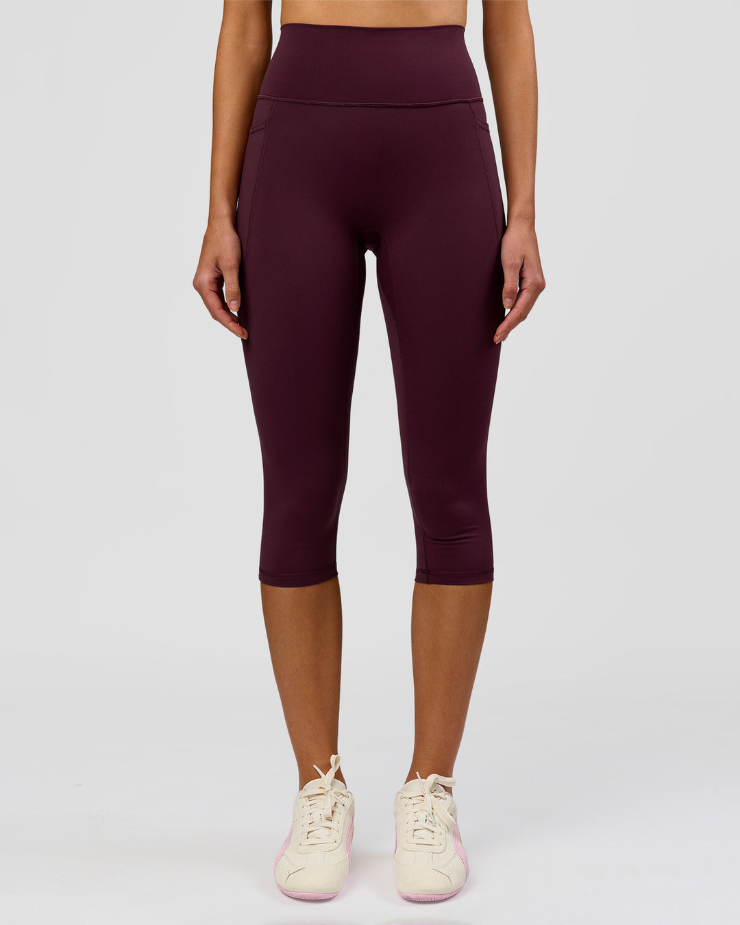 Woman wearing Fusion Ultra High-Rise 3/4 Legging Pockets - Cherry Lacquer | Model:Taneisha | Size:XS - view 1
