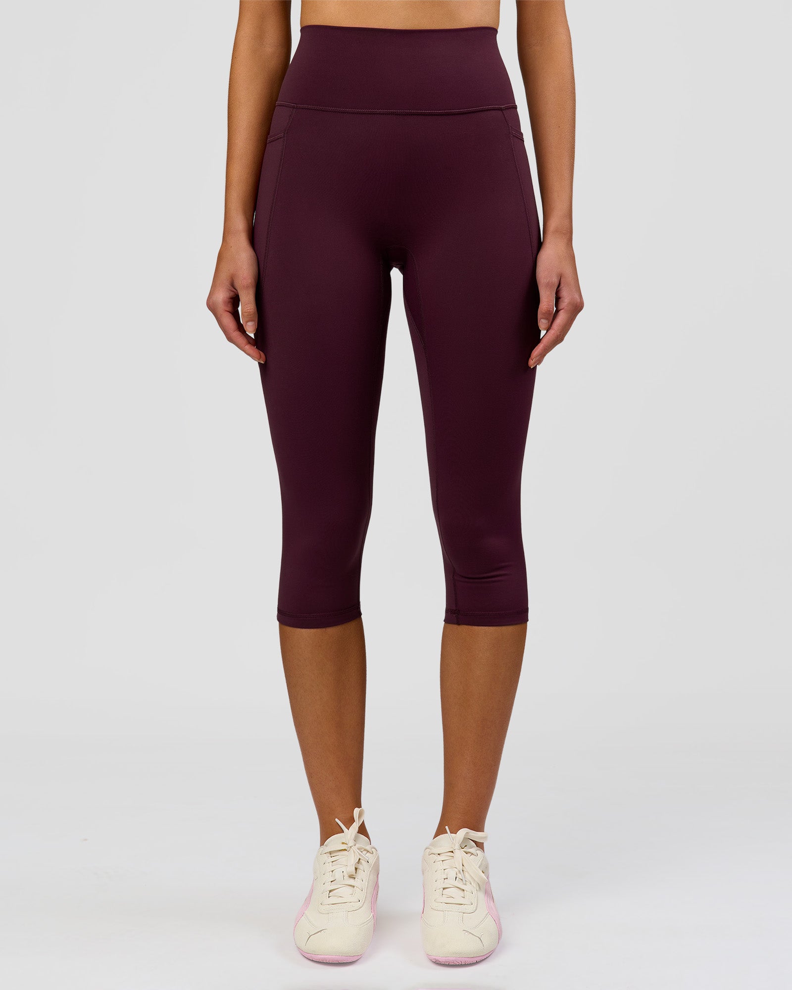 Woman wearing Fusion Ultra High-Rise 3/4 Legging Pockets - Cherry Lacquer | Model:Taneisha | Size:XS