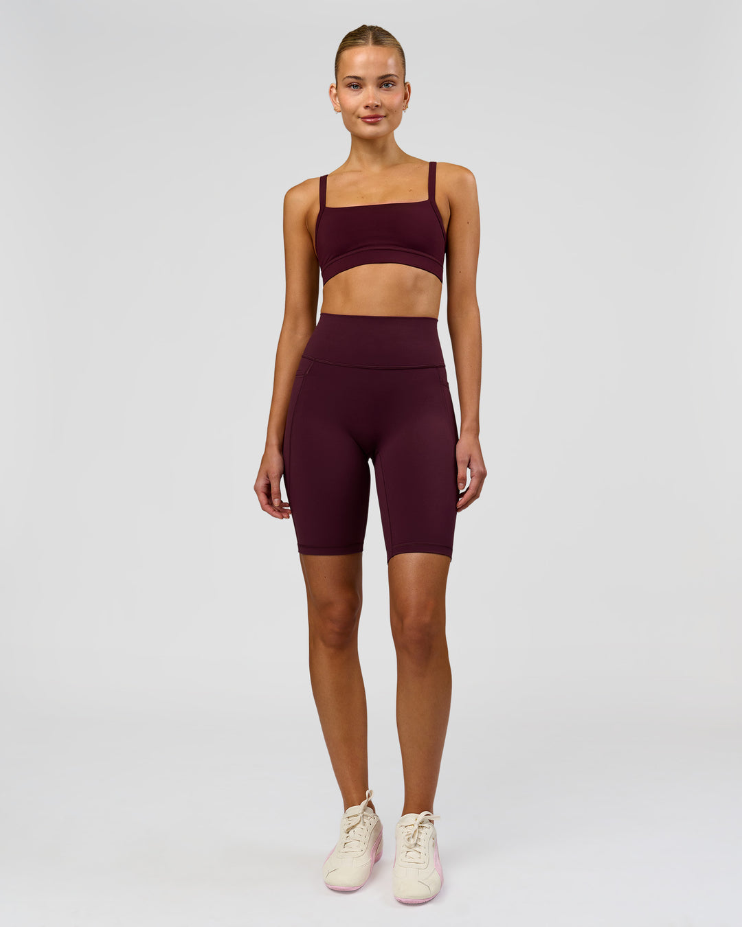 Woman wearing Fusion Ultra High-Rise 9" Short Pockets - Cherry Lacquer | Model:Taneisha | Size:XS - view 1