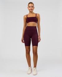 Woman wearing Fusion Ultra High-Rise 9" Short Pockets - Cherry Lacquer | Model:Taneisha | Size:XS | Thumbnail Index: 0