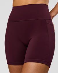 Woman wearing Fusion V-Contour Ultra High-Rise 6" Short Pockets - Cherry Lacquer | Model:Taneisha | Size:XS | Thumbnail Index: 1