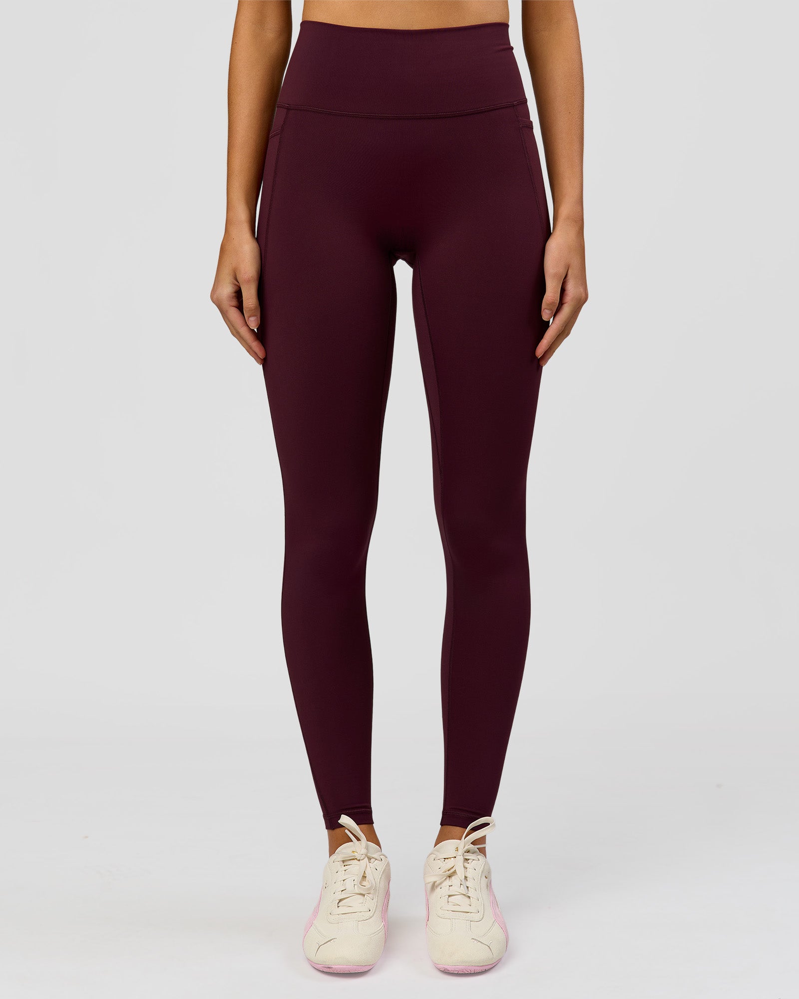 Woman wearing Fusion V-Contour Ultra High-Rise Full Length Legging Pockets - Cherry Lacquer | Model:Taneisha | Size:XS