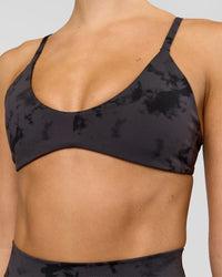 Woman wearing Minimal Sports Bra - Black Tie Dye | Model:Taneisha | Size:XS | Thumbnail Index: 0