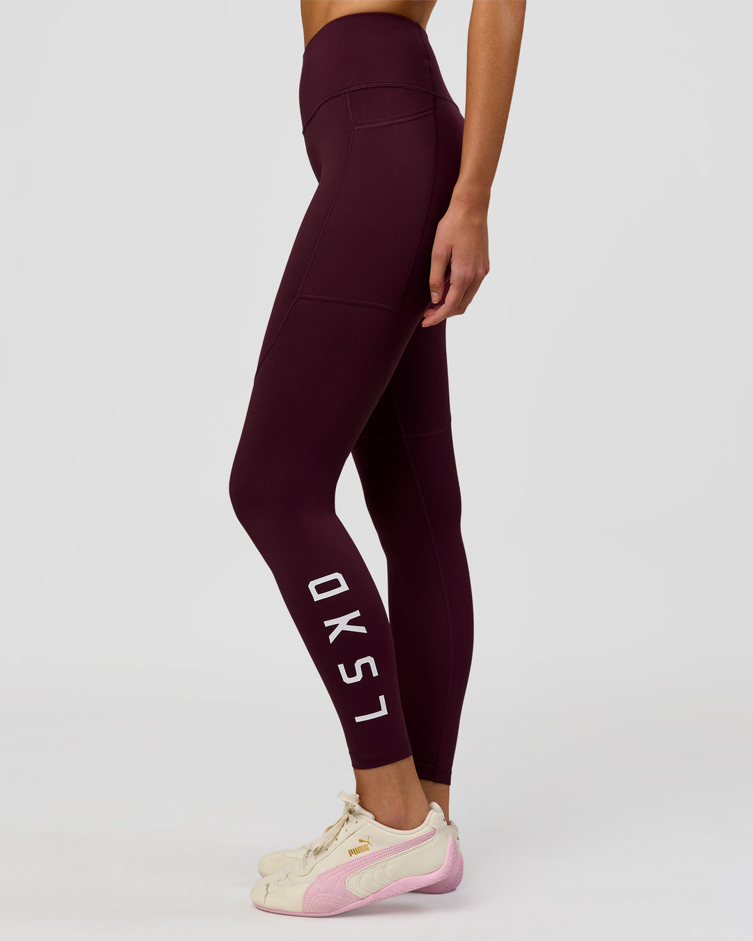 Woman wearing Rep Ultra High-Rise Full Length Legging Pockets - Cherry Lacquer-White | Model:Taneisha | Size:XS - view 1