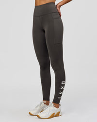 Woman wearing Rep Ultra High-Rise Full Length Legging Pockets - Onyx-white | Model:Taneisha | Size:XS | Thumbnail Index: 0