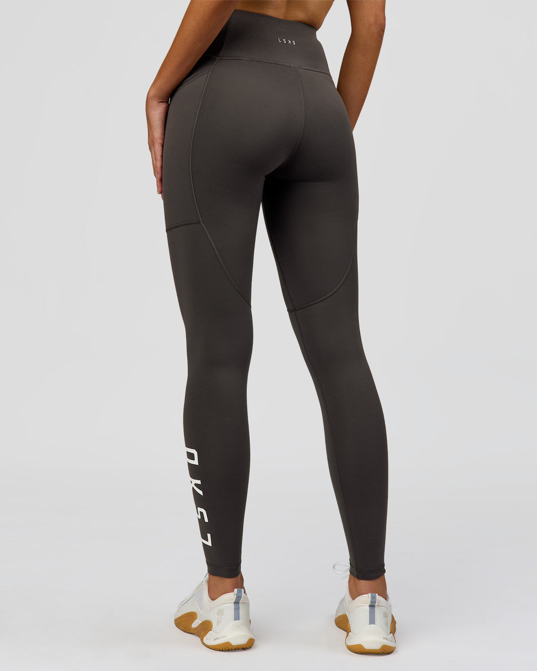 Woman wearing Rep Ultra High-Rise Full Length Legging Pockets - Onyx-white | Model:Taneisha | Size:XS - view 7