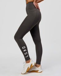 Woman wearing Rep Ultra High-Rise Full Length Legging Pockets - Onyx-white | Model:Taneisha | Size:XS | Thumbnail Index: 10