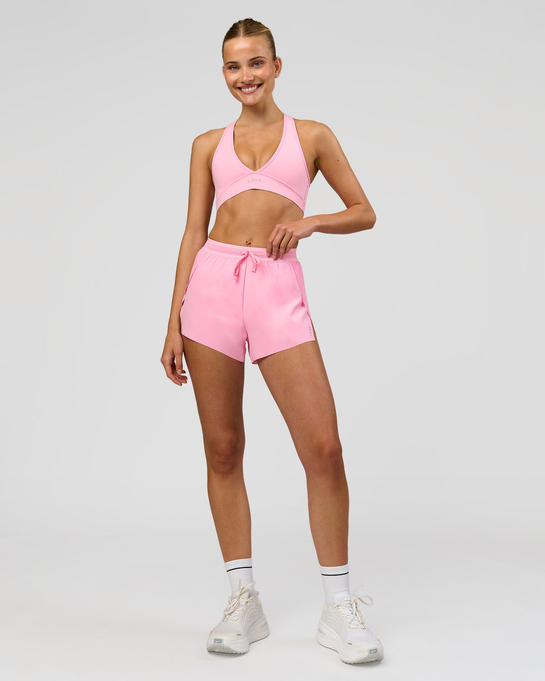 Woman wearing Stamina Sports Bra - Pink Rose | Model:Taneisha | Size:XS