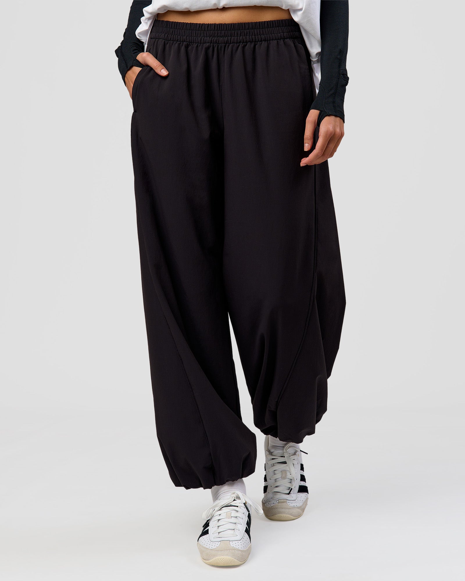 Woman wearing Stitch Up Track Pant - Black | Model:Taneisha | Size:XS