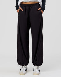 Woman wearing Stitch Up Track Pant - Black | Model:Taneisha | Size:XS | Thumbnail Index: 3