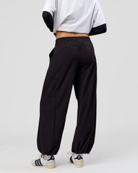 Woman wearing Stitch Up Track Pant - Black | Model:Taneisha | Size:XS | Thumbnail Index: 4