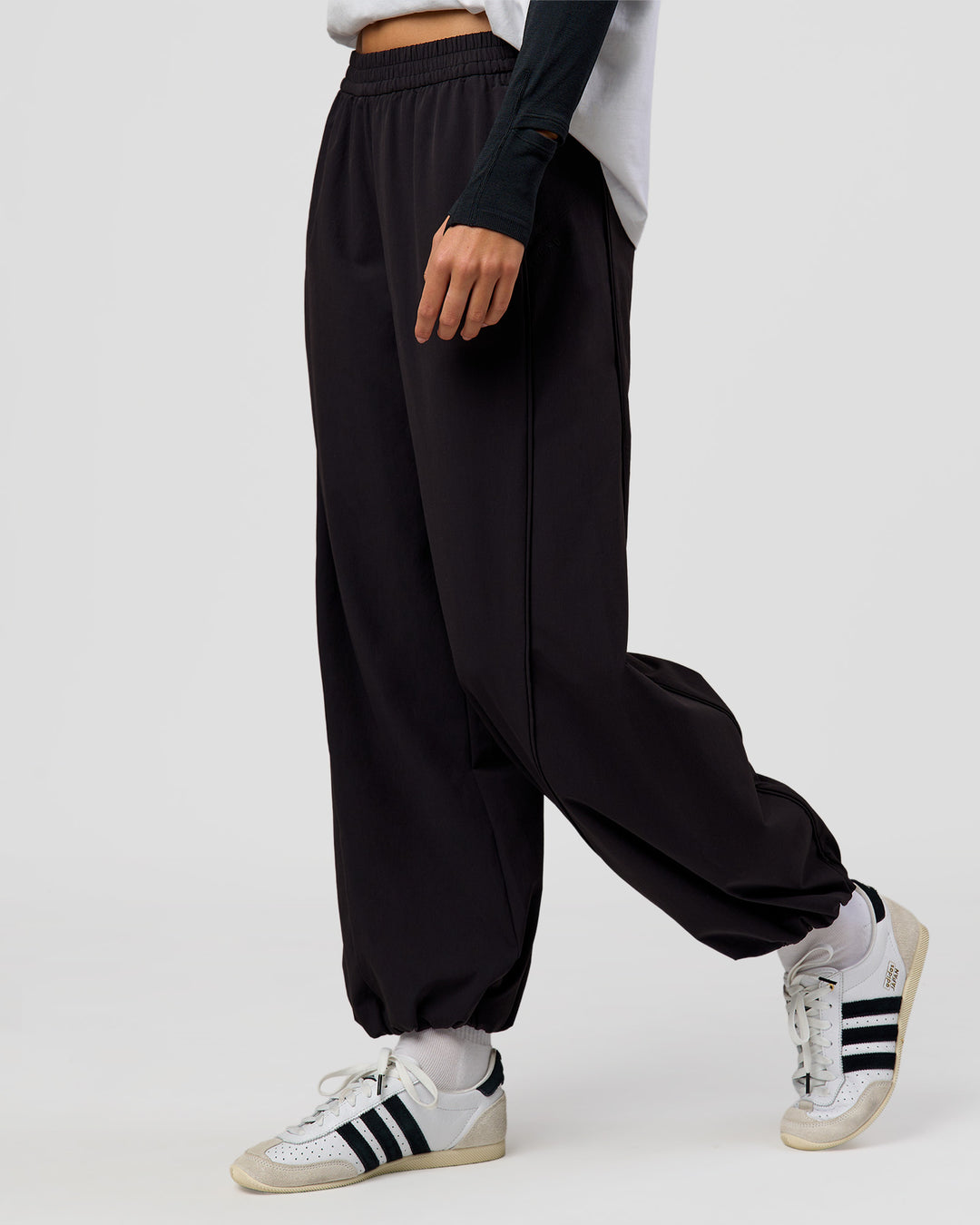 Woman wearing Stitch Up Track Pant - Black | Model:Taneisha | Size:XS - view 1