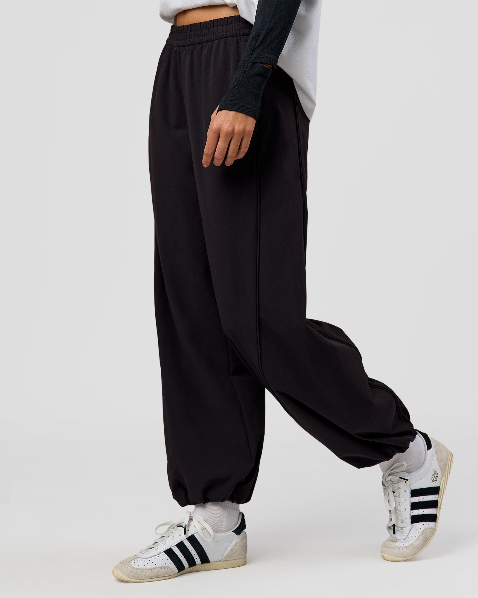 Woman wearing Stitch Up Track Pant - Black | Model:Taneisha | Size:XS