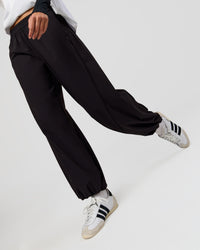 Woman wearing Stitch Up Track Pant - Black | Model:Taneisha | Size:XS | Thumbnail Index: 6