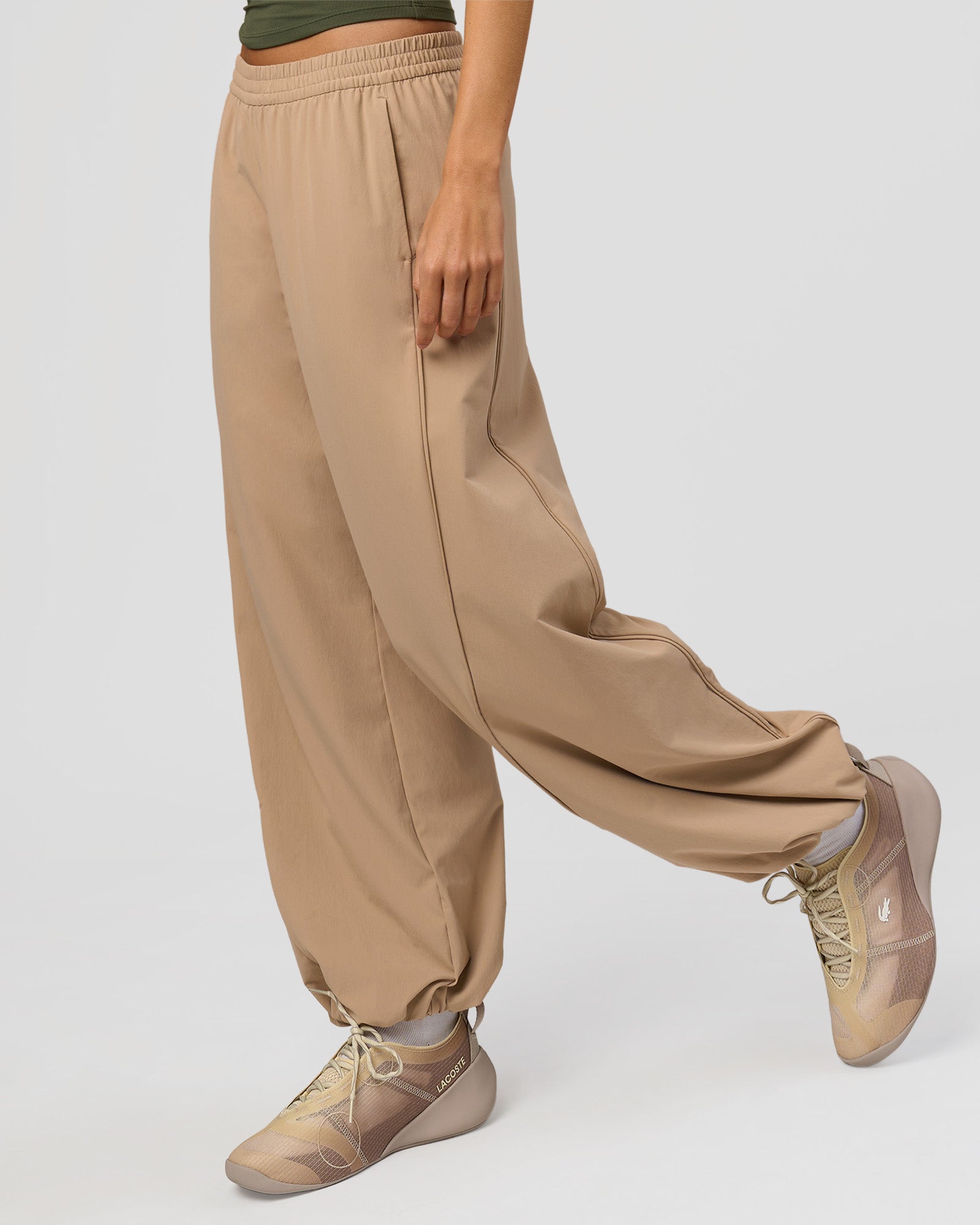 Woman wearing Stitch Up Track Pant - Warm Smoke | Model:Taneisha | Size:XS