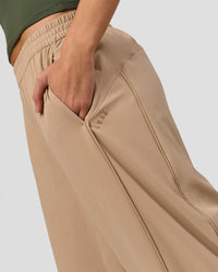 Woman wearing Stitch Up Track Pant - Warm Smoke | Model:Taneisha | Size:XS | Thumbnail Index: 1
