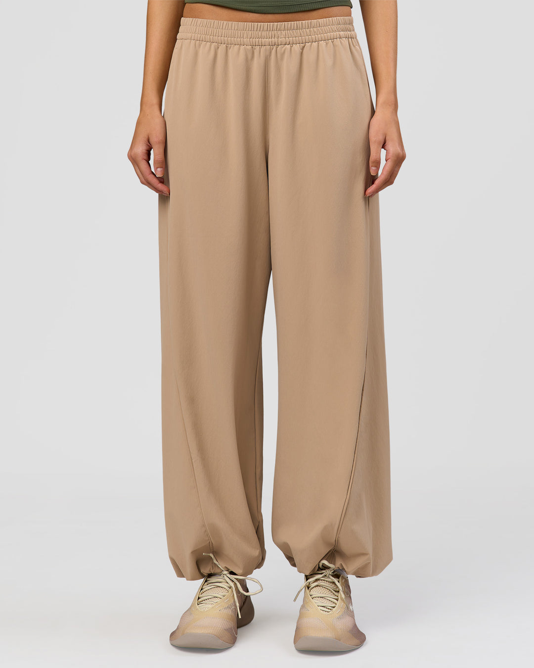 Woman wearing Stitch Up Track Pant - Warm Smoke | Model:Taneisha | Size:XS - view 3