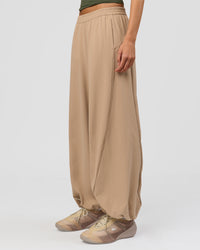 Woman wearing Stitch Up Track Pant - Warm Smoke | Model:Taneisha | Size:XS | Thumbnail Index: 8