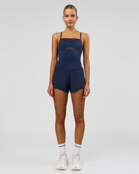 Woman wearing Tia-Clair Toomey-Orr Legacy 3" Run One-Piece - Future Navy | Model:Taneisha | Size:XS | Thumbnail Index: 2