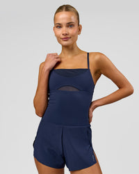 Woman wearing Tia-Clair Toomey-Orr Legacy 3" Run One-Piece - Future Navy | Model:Taneisha | Size:XS | Thumbnail Index: 3