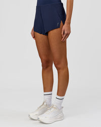 Woman wearing Tia-Clair Toomey-Orr Legacy 3" Run One-Piece - Future Navy | Model:Taneisha | Size:XS | Thumbnail Index: 11