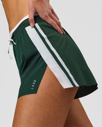 Woman wearing Trackline Accelerate 3" High-Rise Running Short - Midnight Green-White | Model:Taneisha | Size:XS | Thumbnail Index: 1