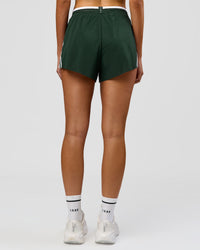 Woman wearing Trackline Accelerate 3" High-Rise Running Short - Midnight Green-White | Model:Taneisha | Size:XS | Thumbnail Index: 16