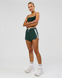 Woman wearing Trackline Accelerate 3" High-Rise Running Short - Midnight Green-White | Model:Taneisha | Size:XS | Thumbnail Index: 19