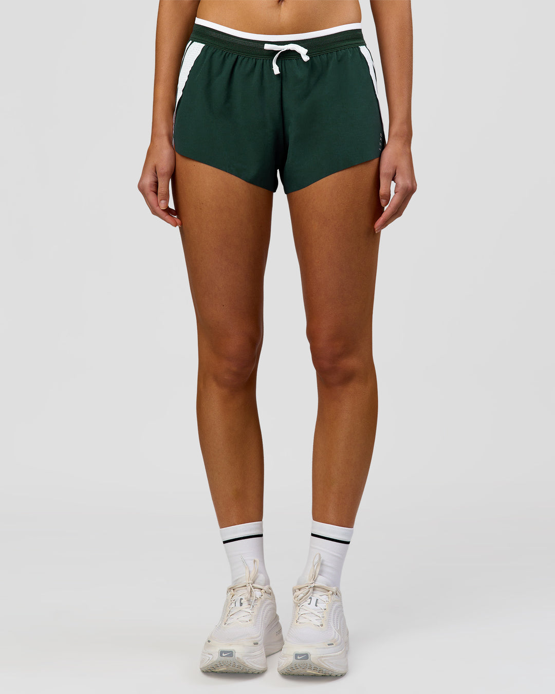 Woman wearing Trackline Accelerate 3" Mid Rise Running Short - Midnight Green-White | Model:Taneisha | Size:XS - view 9