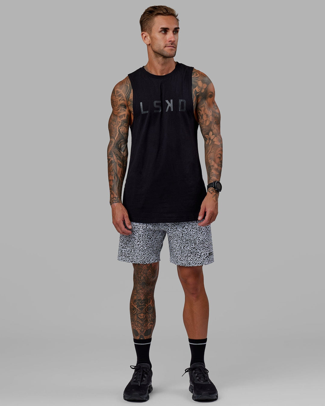 Man wearing Rep 7" Performance Short - Spotty White-Black
