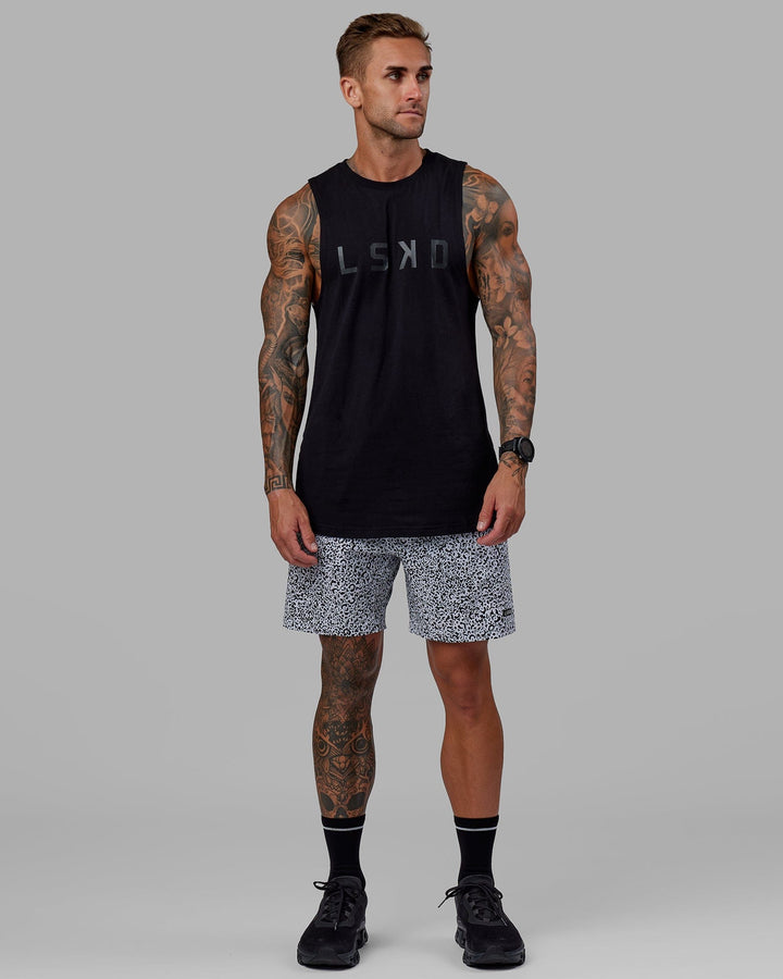 Man wearing Rep 7" Performance Short - Spotty White-Black