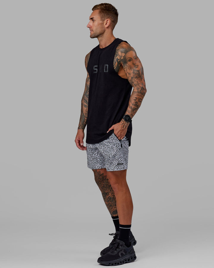 Man wearing Rep 7" Performance Short - Spotty White-Black