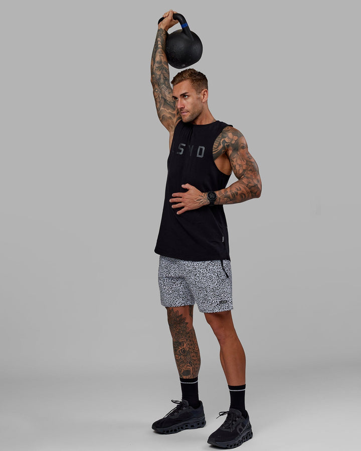 Man wearing Rep 7" Performance Short - Spotty White-Black
