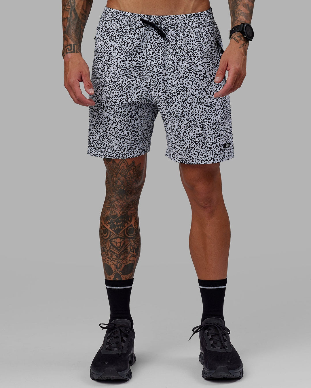 Man wearing Rep 7" Performance Short - Spotty White-Black