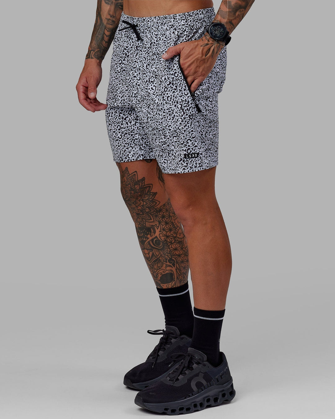 Man wearing Rep 7" Performance Short - Spotty White-Black