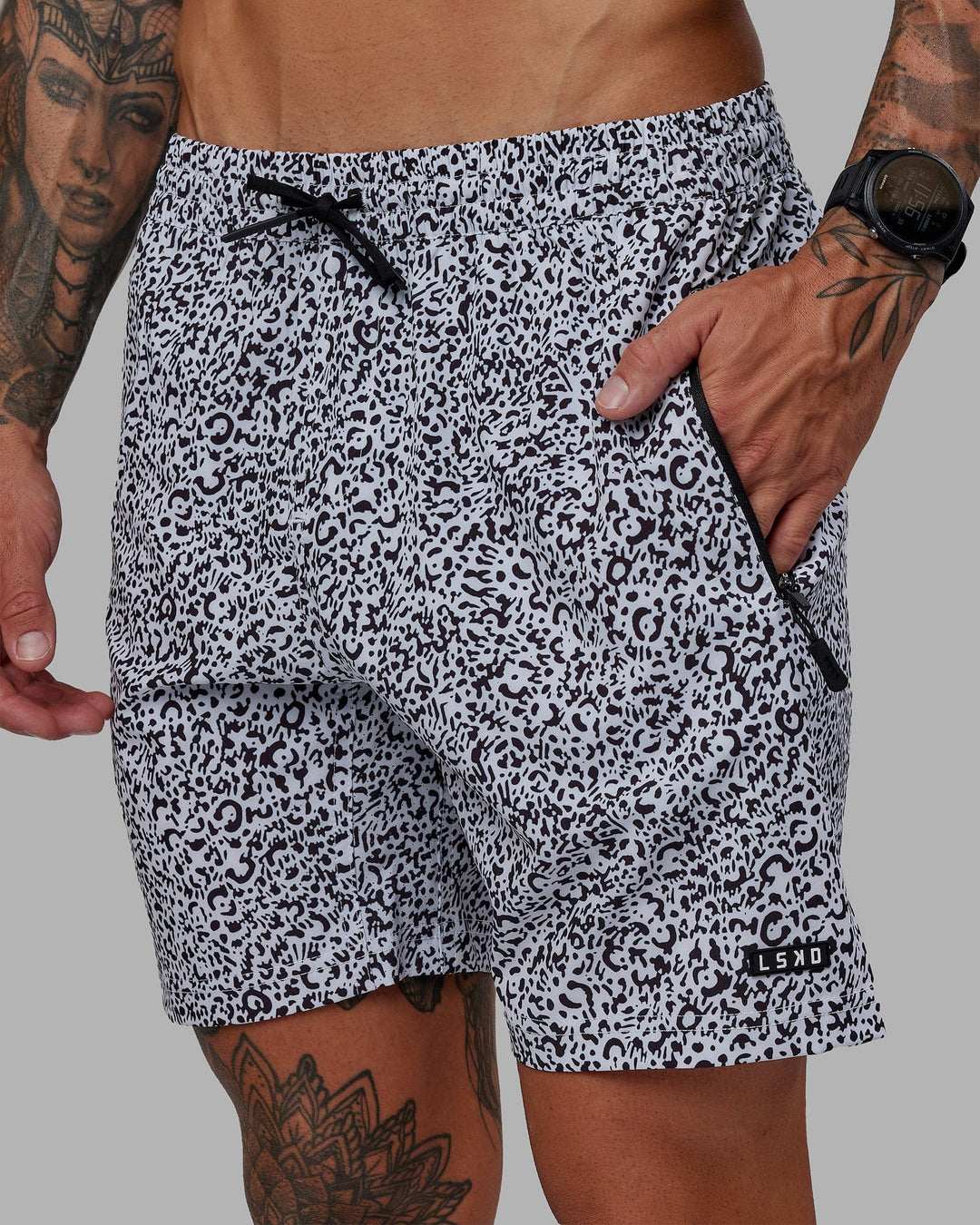 Man wearing Rep 7" Performance Short - Spotty White-Black