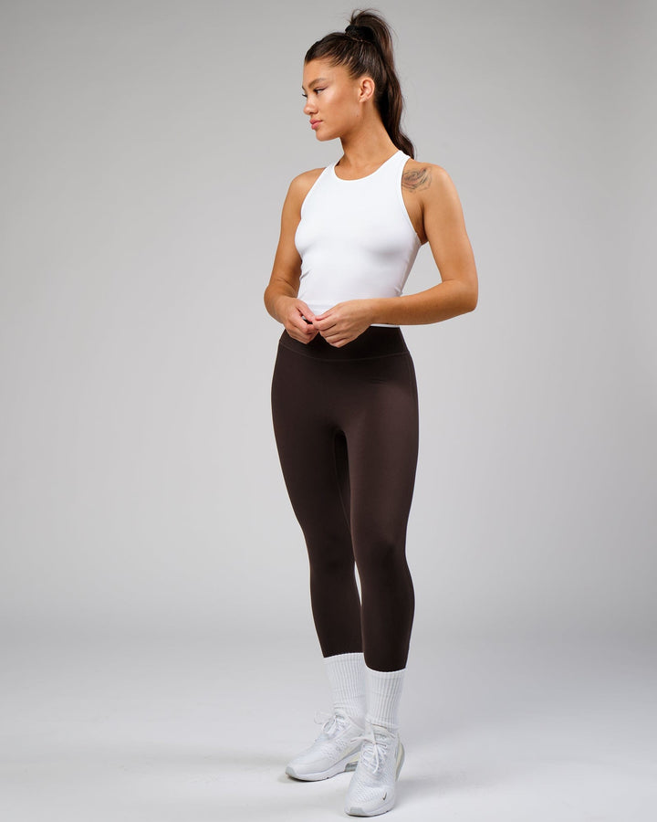 Woman wearing Flow Performance Tank - White