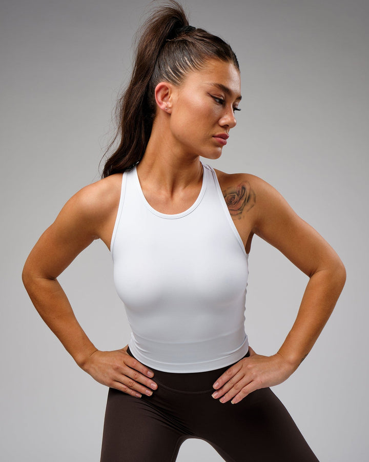 Woman wearing Flow Performance Tank - White