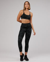 Woman wearing Elixir Ultra High-Rise 7/8 Legging - Black Camo | Model:Chelsea | Size:S