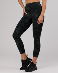 Woman wearing Elixir Ultra High-Rise 7/8 Legging - Black Camo | Model:Chelsea | Size:S