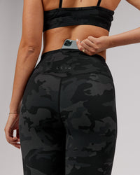 Woman wearing Elixir Ultra High-Rise 7/8 Legging - Black Camo | Model:Chelsea | Size:S